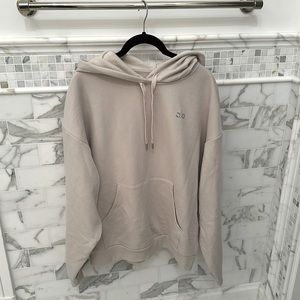 Alo yoga beige hoodie with silver metallic logo. Size medium.